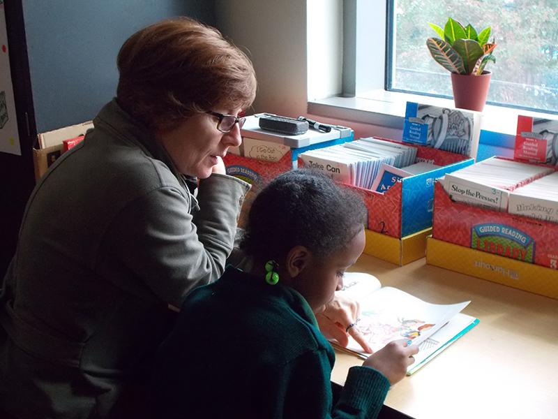 Tulane Service Learning Student Reading with her buddy at Crocker